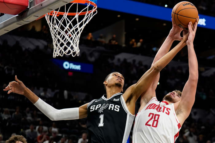Rockets center Alperen Sengun (28) shoots over San Antonio Spurs forward Victor Wembanyama (1) during the first half against at Frost Bank Center.